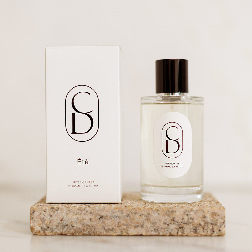 Perfume bottle and packaging on a neutral background