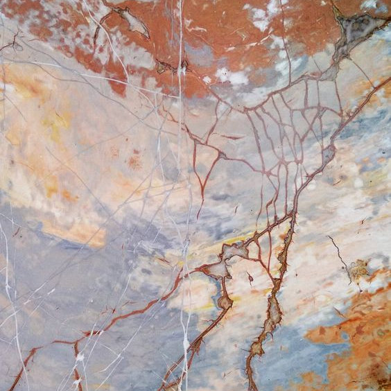 Marble-like texture with brown, beige, and gray colors